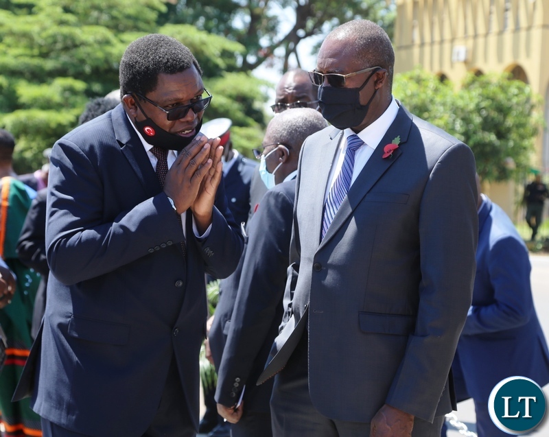 Foreign Affairs Minister Joseph Malanji (left) confers with his Finance Counterpart Minister Dr Bwalya Ngandu during the remembrance day at the National Cenotaph in Lusaka.Picture by SUNDAY BWALYA/ZANIS