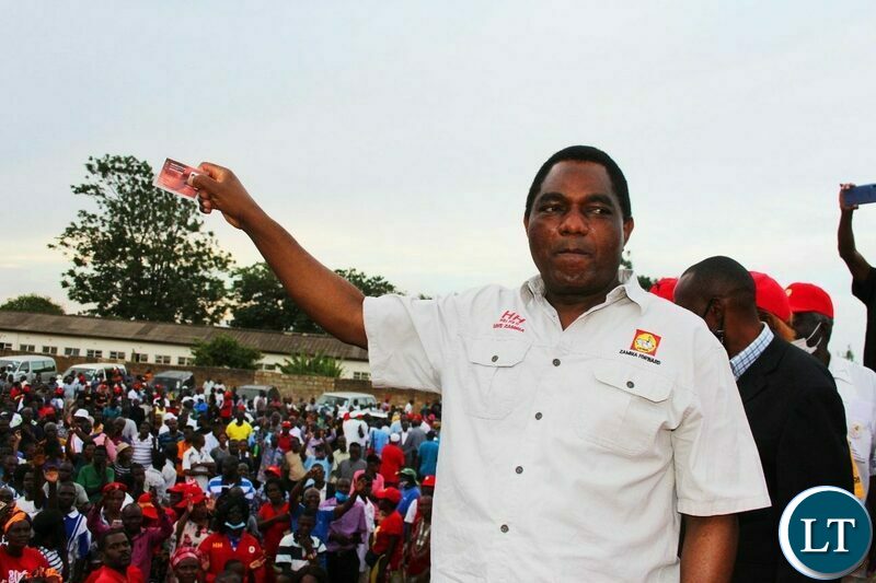 UPND Leader Hakainde Hichilema waves  his voters card at the Party Mobilisation rally in Lusaka 