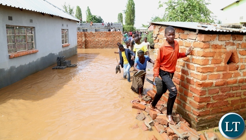 Same Mumbwa residents walk off there submerged house hopeless after the Kandesha dam burst it banks causing the flash floods yesterday. Sunday, December 27, 2020. Picture by ROYD SIBAJENE/ZANIS