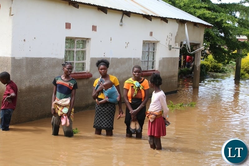 Same Mumbwa residents watch there submerged house hopeless after the Kandesha dam burst it banks causing the flash floods yesterday. Sunday, December 27, 2020. Picture by ROYD SIBAJENE/ZANIS