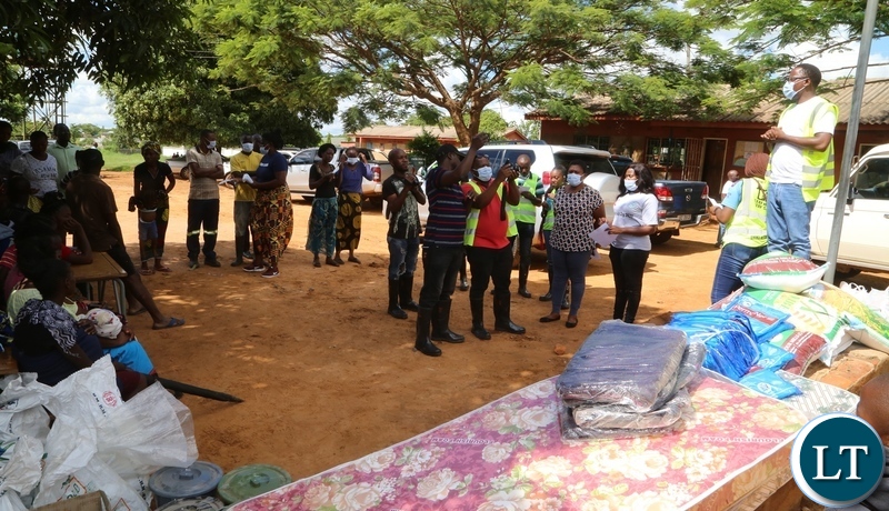 DMMU national coordinator Chanda Kabwe and defence force officershandoer relief food and other staffs to the victims of the flash floods caused by Kandesha dam which burst its banks creating flash floods yesterday. Sunday, December 27, 2020. Picture by ROYD SIBAJENE/ZANIS