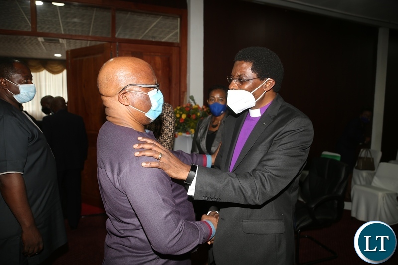 Bishop Joshua Banda confers with former Vice President Nevers Mumba during the commemoration of the declaration of Zambia as a Christian Nation at mulungushi international conference centre yesterday. Tuesday, December 29, 2020. Picture by ROYD SIBAJENE/ZANIS   