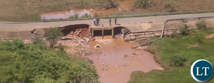 45% washed aways mambwa bridge along landless corner road in Mumbwa District after the Kandesha dam burst it banks creating flash floods yesterday. Sunday, December 27, 2020. Picture by ROYD SIBAJENE/ZANIS