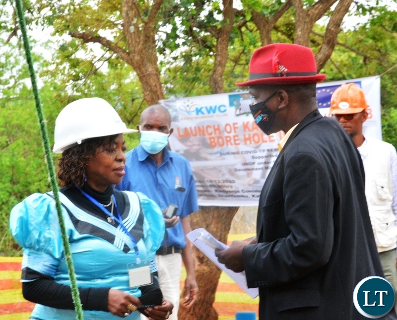 Kaiko Women's Club Chairperson Getrude Mundia talks to Headman Kakote during the launch of Kaiko Women's Club Bore hole initiative in Shantumbu
