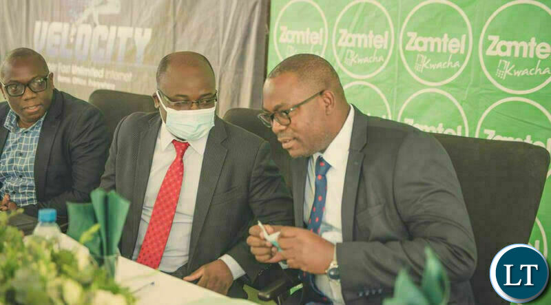 Transport and Communications Mutotwe Kafwaya chats with Zamtel CEO Sydney Mupeta during the launch of Unlimited Freedom at Zamtel House on Friday morning