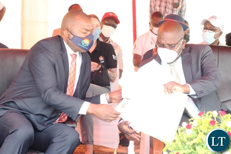 Minister of Health, Chitulu Chilufya(r)confers with Lusaka Province Minister, Bowman Lusambo during world Aids day in Lusaka