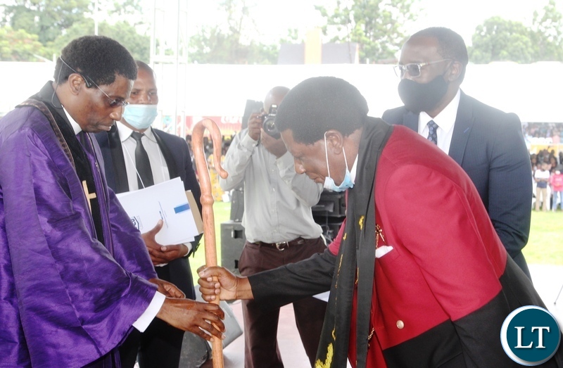 Pentecostal Assemblies of God(PAOG), Bishop Dr.David Banda receives a from immediate -past Presiding Bishop ,Robertson Nonde during the installation of presiding Bishop and unveiling presentation of full council of bishops in Lusaka.