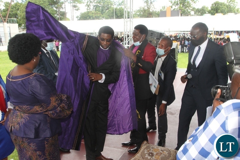 Pentecostal Assemblies of God(PAOG), Bishop Dr.David Banda being decorated by Immediate-past Presiding Bishop,Robertson Nonde during the installation of presiding Bishop and unveiling presentation of full council of bishops in Lusaka.