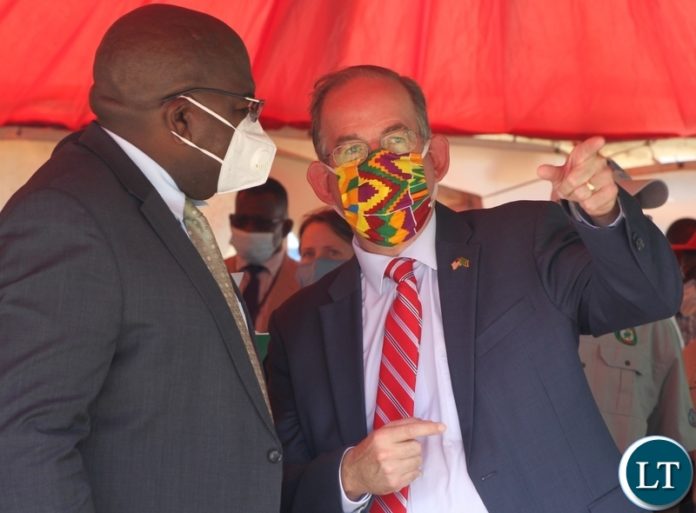 Minister of Health, Chitalu Chilufya talks to American charge de' Affair to Zambia, David Young at world Aids day in Lusaka Minister of Health, Chitalu Chilufya talks to American charge de' Affair to Zambia, David Young at world Aids day in Lusaka
