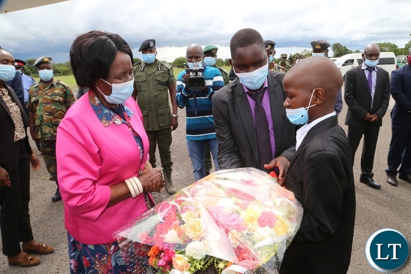 Vice President Inonge Wina receive flowers from Mubita on her arrival in Mongu for a three day working visit in Western Province yesterday. Saturday, January 02, 2021. Picture by ROYD SIBAJENE/ZANIS