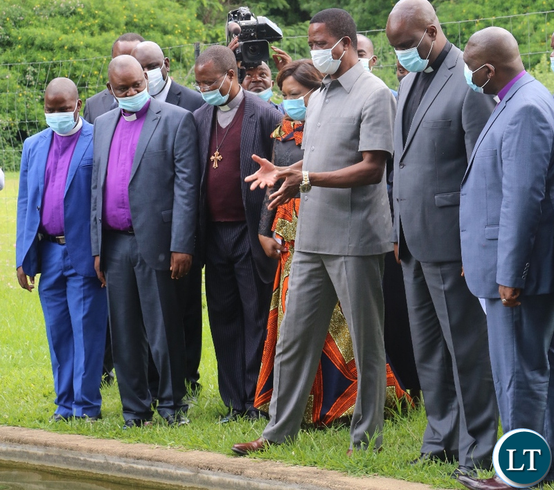 President Edgar Lungu and the clergymen from Reformed Church in Zambia drawn across the country being shown fish pond at State House in Lusaka.