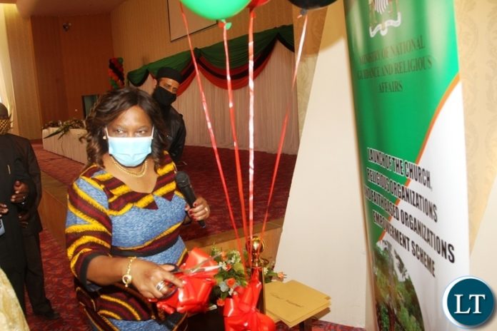 National Guidance and Religious Affairs Minister Rev Godfredah Sumaili speaking during the launch of an Empowerment Scheme for Churches,Religious and Faith Based organisations at Government Complex