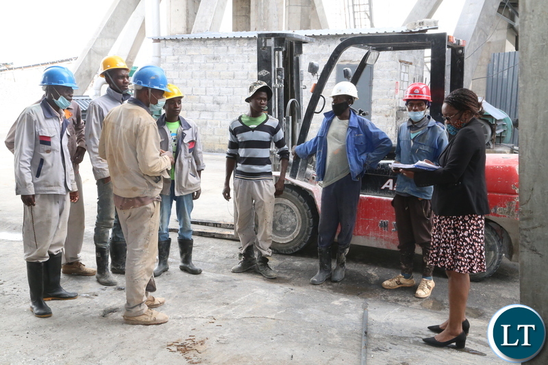 Ministry of Labour Principal Labour Officer Joseph Kaindama confers with workers without proper working suit at Anshan Investment Zambia Limited durning the inspection of the how the company is keeping the workers if it according to the labour laws. Yesterday, Wednesday January 10, 2021. Picture by ROYD SIBAJENE/ZANIS