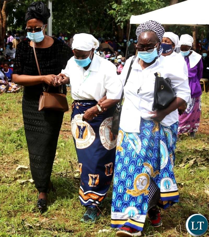 Late Sebastian Zulu's Widow Nyondo (middle) being led to take a seat during burial of her late Husband in Petauke's Kakwiya village. Picture by SUNDAY BWALYA /ZANIS