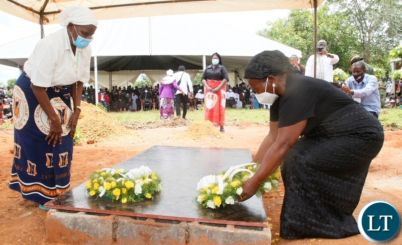Late Sebastian Zulu's Widows lay wreaths at the grave of their late husband during burial in Petauke's Kakwiya village. Picture by SUNDAY BWALYA/ ZANIS
