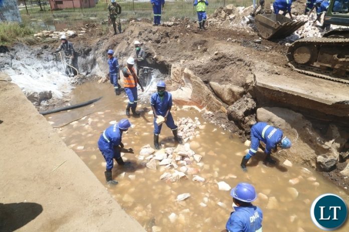 Engineers from ZNS and Zambia Army working on the drainage system being built to help flooding off Kanyama area at road 55