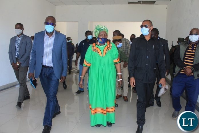 Vice President Inonge Wina (c) with Infrastructure Minister Vincent Mwale (r) and Finance Minister Bwalya Ng’andu (l) during assessment of the work progress for the new district administration block for Limulunga District