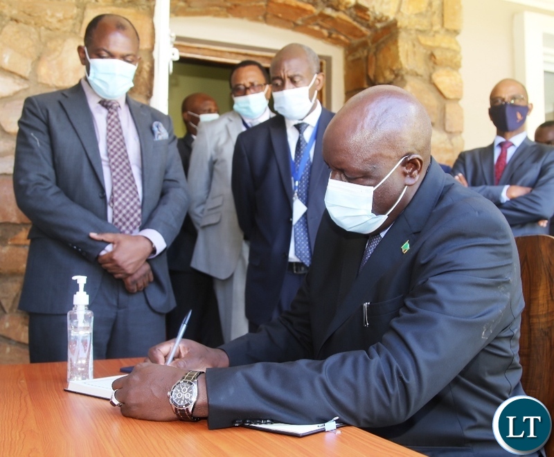 Secretary to Cabinet Simon Miti (left) consoles Dr Rowland Msikas's Widow Glysin Msiska (third from left) when he visited the funeral house of the late former Secretary to Cabinet in Lusaka.Picture by SUNDAY BWALYA/ZANIS