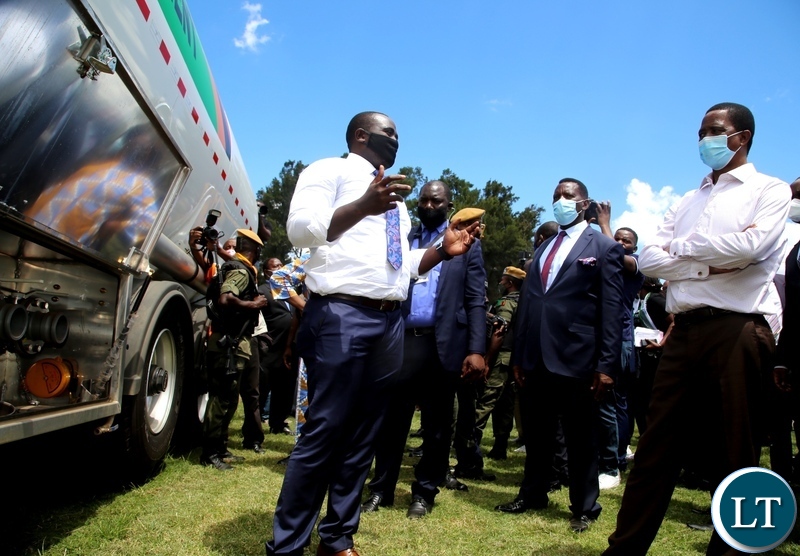 Minister of youth and sports Emmanuel Mulenga (left) explains how the fuel tankers the Government has bought for youths will be operated during this year's youth day commemorations at Mulungushi conference centre in Lusaka. Picture by SUNDAY BWALYA/ZANIS