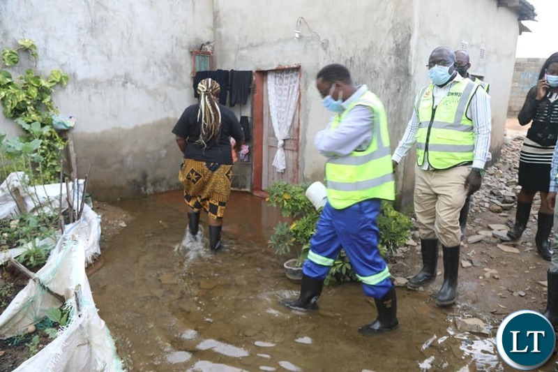 Disaster Management and Mitigation Unit-DMMU National Coordinator Chanda Kabwe touring the he flooded communities of Chawama compound