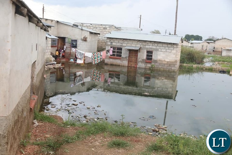 Disaster Management and Mitigation Unit-DMMU National Coordinator Chanda Kabwe touring the he flooded communities of Chawama compound