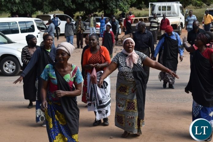 Women from the Mukuni Royal Establishment of Kazungula District yesterday protested outside the Livingstone Central police station demanding the release of Chief Mukini's wife who was arrested on Monday. Picture by KELVIN MUDENDA