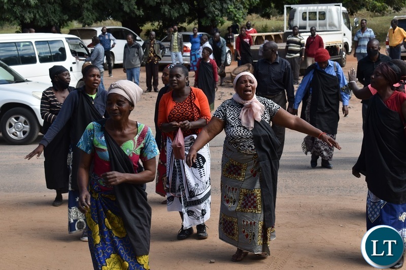 Women from the Mukuni Royal Establishment of Kazungula District yesterday protested outside the Livingstone Central police station demanding the release of Chief Mukini's wife who was arrested on Monday. Picture by KELVIN MUDENDA