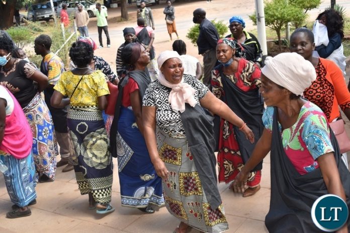 Women from the Mukuni Royal Establishment of Kazungula District yesterday protested outside the Livingstone Central police station demanding the release of Chief Mukini's wife who was arrested on Monday. Picture by KELVIN MUDENDA