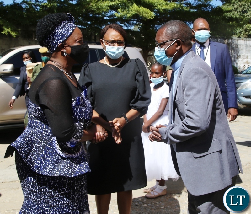 ST Kizito Parish Priest Father Isaac Chabu welcomes First lady Esther Lungu to officiate at a donation of food hampers in George Compound in Lusaka. Picture by SUNDAY BWALYA/ZANIS