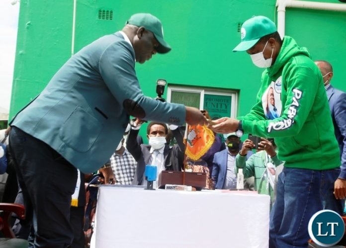 President Edgar Lungu hands in nomination fee to PF Party Secretary General Davies Mwila during the filling in of nominations at the PF Secretariat. Picture by SUNDAY BWALYA/ZANIS President Edgar Lungu hands in nomination fee to PF Party Secretary General Davies Mwila during the filling in of nominations at the PF Secretariat. Picture by SUNDAY BWALYA/ZANIS