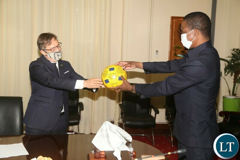 President Edgar Lungu receives a ball with covid-19 message from European Union Ambassador Mr.Jacek Jankowski at State House