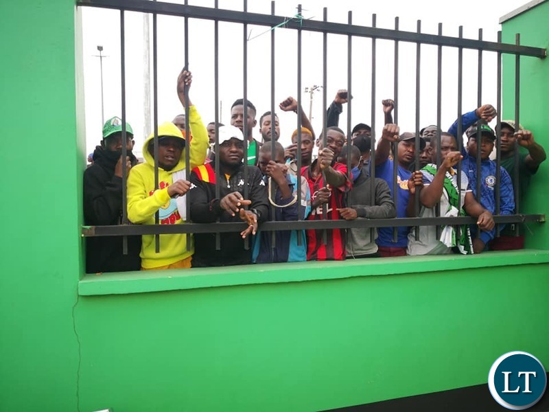 PF cadres who could not get a spot happy to following the proceedings behind the fence to the party's Secretariate