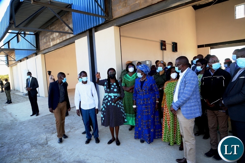Western Province CEEC manager Maureen Makwembo explains on the progress of the Vice President Inonge Wina and her encourage listens during the tour of the industrial yard in Mongu yesterday. Thursday, May 27, 2021. Picture by ROYD SIBAJENE/ZANIS