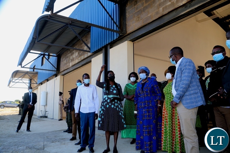 Western Province CEEC manager Maureen Makwembo explains on the progress of the Vice President Inonge Wina and her encourage listens during the tour of the industrial yard in Mongu yesterday. Thursday, May 27, 2021. Picture by ROYD SIBAJENE/ZANIS