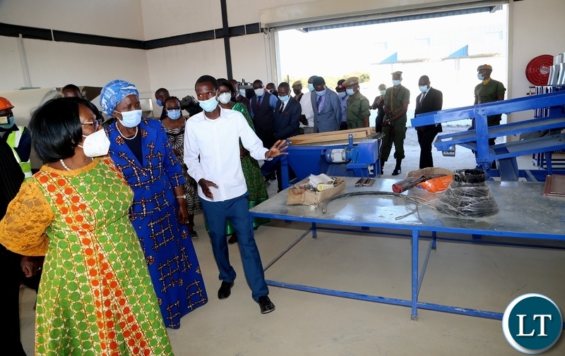 Western Province CEEC manager Maureen Makwembo explains on the progress of the Vice President Inonge Wina and her encourage listens during the tour of the industrial yard in Mongu yesterday. Thursday, May 27, 2021. Picture by ROYD SIBAJENE/ZANIS