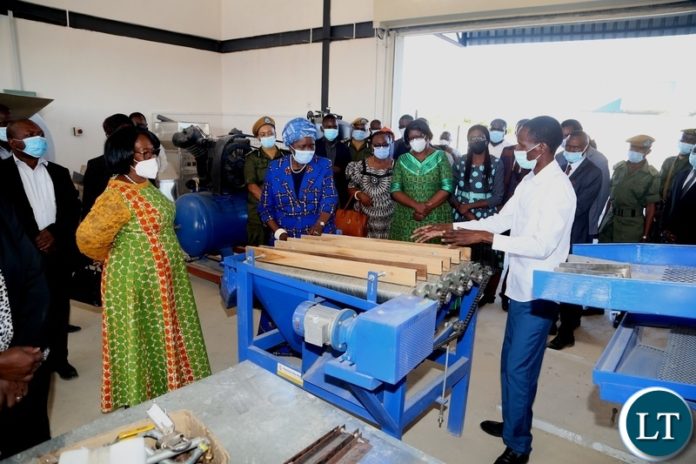 Western Province CEEC manager Maureen Makwembo explains on the progress of the Vice President Inonge Wina and her encourage listens during the tour of the industrial yard in Mongu yesterday. Thursday, May 27, 2021. Picture by ROYD SIBAJENE/ZANIS Western Province CEEC manager Maureen Makwembo explains on the progress of the Vice President Inonge Wina and her encourage listens during the tour of the industrial yard in Mongu yesterday. Thursday, May 27, 2021. Picture by ROYD SIBAJENE/ZANIS