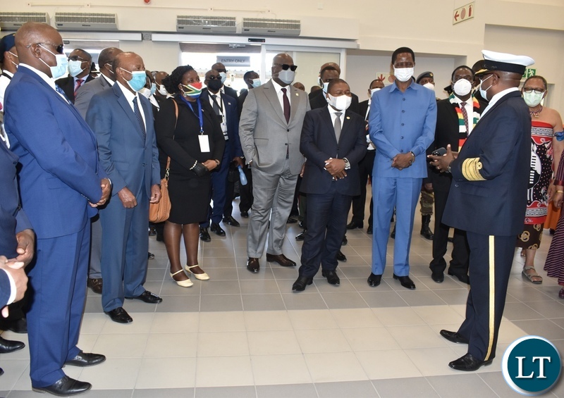 Director General of Immigration Dr Denny Lungu briefing the visiting Heads of State on the newly opened Passenger terminal at Kazungula one stop border post