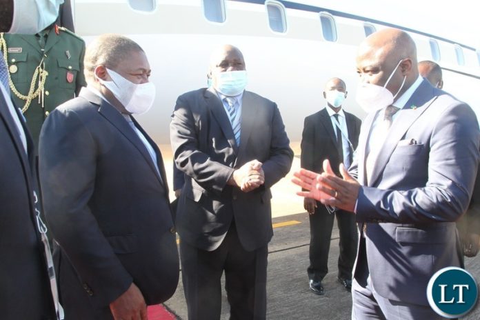 President of Mozambique,Filipe Jacinto Nhusi is welcomed by Home Affairs Steven Kampyongo at Harry Mwaanga Nkumbula International Airport for the commissioning of Kasungula bridge. President of Mozambique,Filipe Jacinto Nhusi is welcomed by Home Affairs Steven Kampyongo at Harry Mwaanga Nkumbula International Airport for the commissioning of Kasungula bridge.