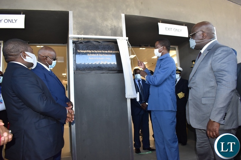 President Edgar Lungu unveils the plaque at Kazungula bridge one stop border post on the Zambian side whilst other Heads of state look on