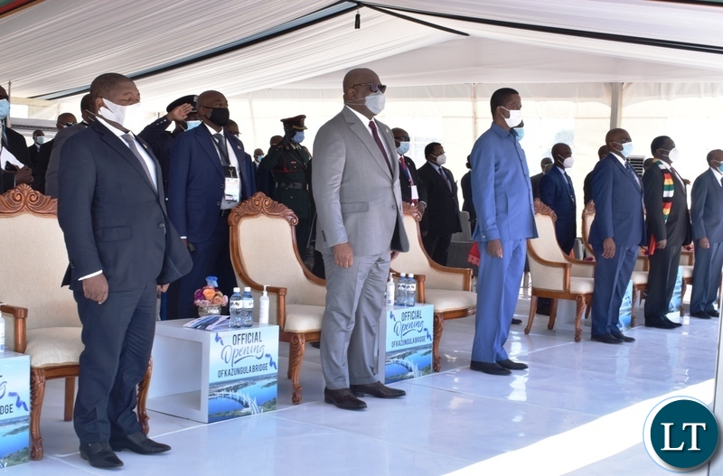 Presidents listening to nation anthems being played during the official opening of Kazungula border post