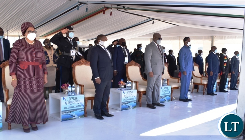 Presidents stand as national anthems are being played during the offcial opening of Kazungula bridge