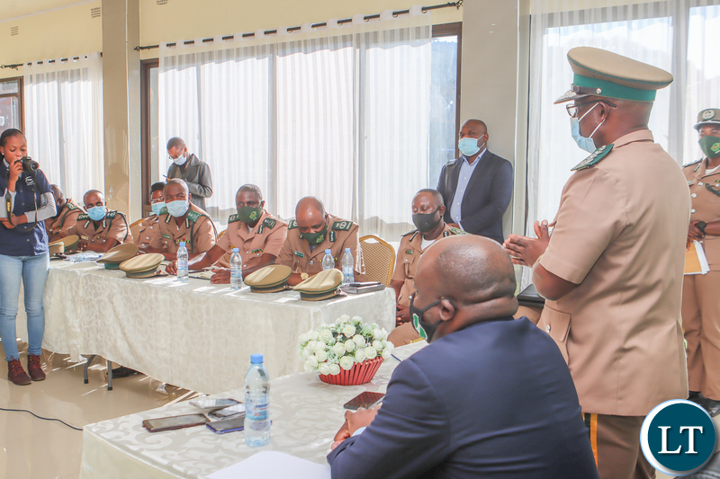 Zambia Correctional Service Commissioner General Dr Chisela Chileshe speaking during the signing ceremony as Commissioners listen on