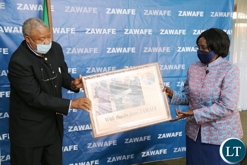 Vice President Inonge Wina receive a present from Zambia Water Forum Exhibition Chairperson Imasiku Nyambe, the present is for her contribution towards the water sector shortly after the virtual meeting yesterday. Monday, June 7, 2021. Picture by ROYD SIBAJENE/ZANIS