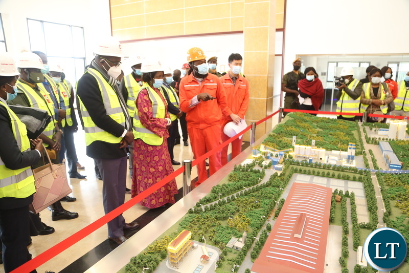 Brick factory process controller Mwala Paul welcomes Vice President Inonge Wina and her entourage during the tour of the Sinoma Cement factory in Chongwe District yesterday. Tuesday, June 8, 2021. Picture by ROYD SIBAJENE ZANI