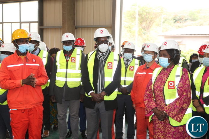 Mr.Paikani Banda shows the Vice President Inonge Wina and her entourage the map of the Sinoma Cement factory during the tour of the Sinoma Cement in Chongwe District yesterday. Tuesday, June 8, 2021. Picture by ROYD SIBAJENE ZANIS