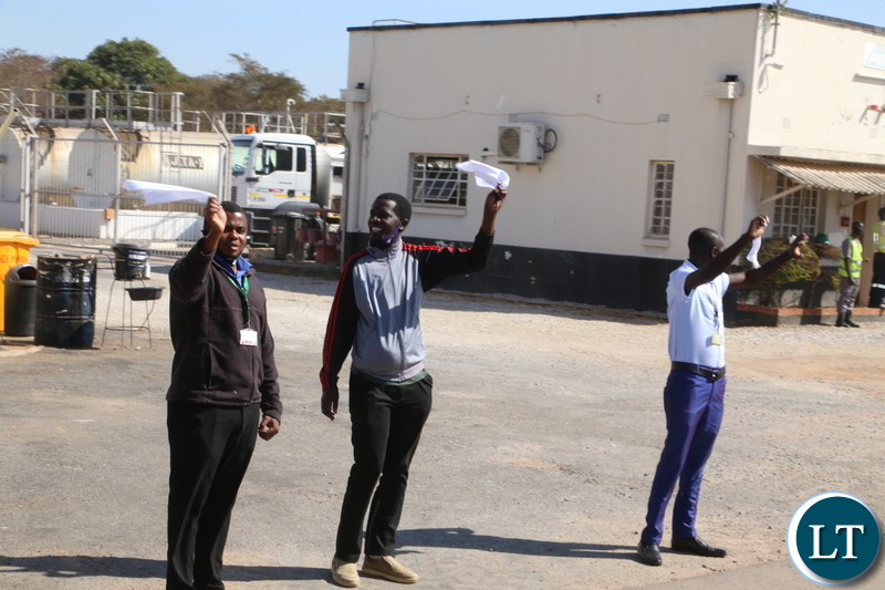 Ndola residents mourn the late first Zambian President Dr Kenneth Kaunda by waving white handkerchiefs a symbol for the late when the remains where being driven through Ndola town yesterday. Monday, June 28, 2021. Picture by ROYD SIBAJENE ZANIS 
