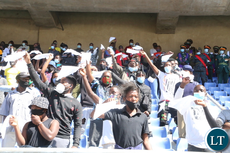 Ndola residents mourn the late first Zambian President Dr Kenneth Kaunda by waving white handkerchiefs a symbol for the late when the remains where being driven through Ndola town yesterday. Monday, June 28, 2021. Picture by ROYD SIBAJENE ZANIS
