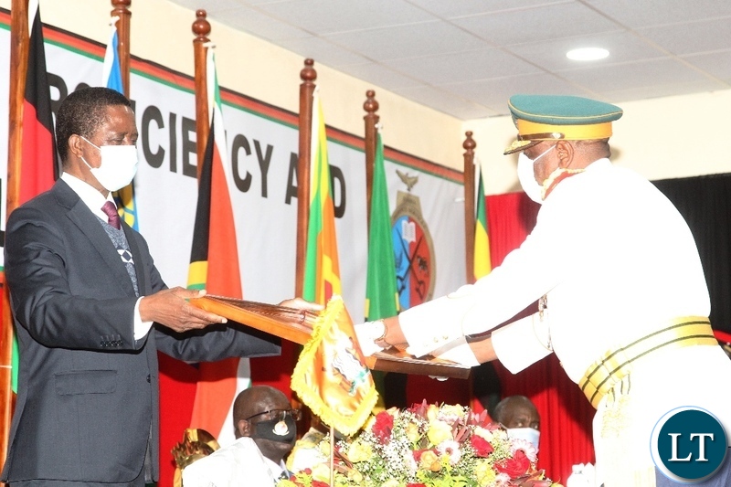 President Edgar Lungu gives a recognition award to Zambia National Service Commandant ,Lt. General,Nathhan Mulenga during the silver jubilee celebration and official launch of the new staff college and National Defence University in Lusaka.