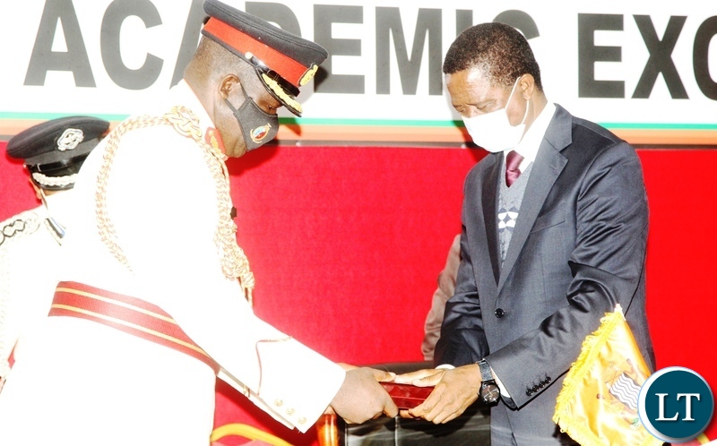 President Edgar Lungu receives a recognition award from College Commandant, Brig. General ,Benson Musonda during the silver jubilee celebration and official launch of the new staff college and National Defence University in Lusaka.