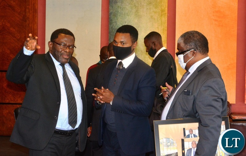 FORMER Cabinet, Peter Machungwa(left) confers Darlington Chiluba(m)a and former Press aide, Richard Sakala during the 2nd memorial lecture in honour of late republican president Dr. Titus Chiluba in Lusaka